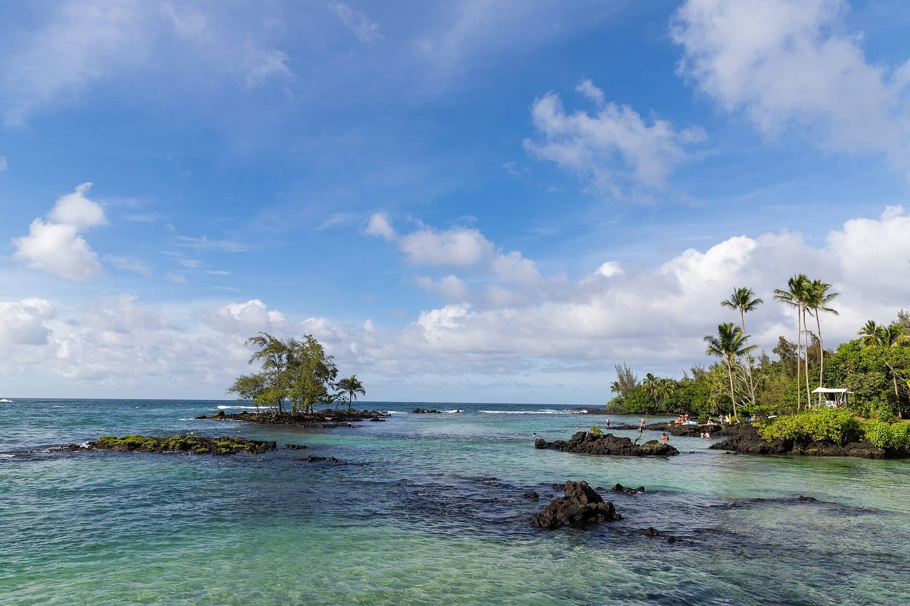 Calm, clear water and small lava islets at Carlsmith Beach Park in Hilo