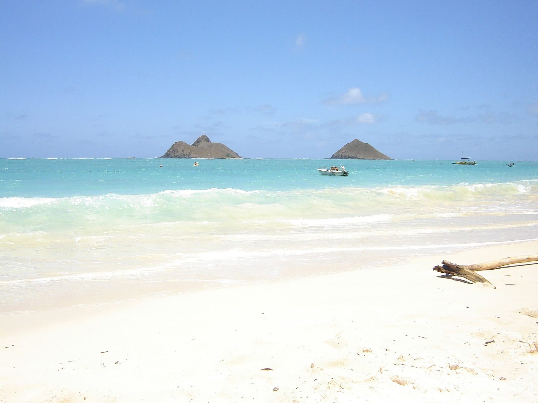 Nā Mokulua islets offshore from the white sand of Lanikai Beach