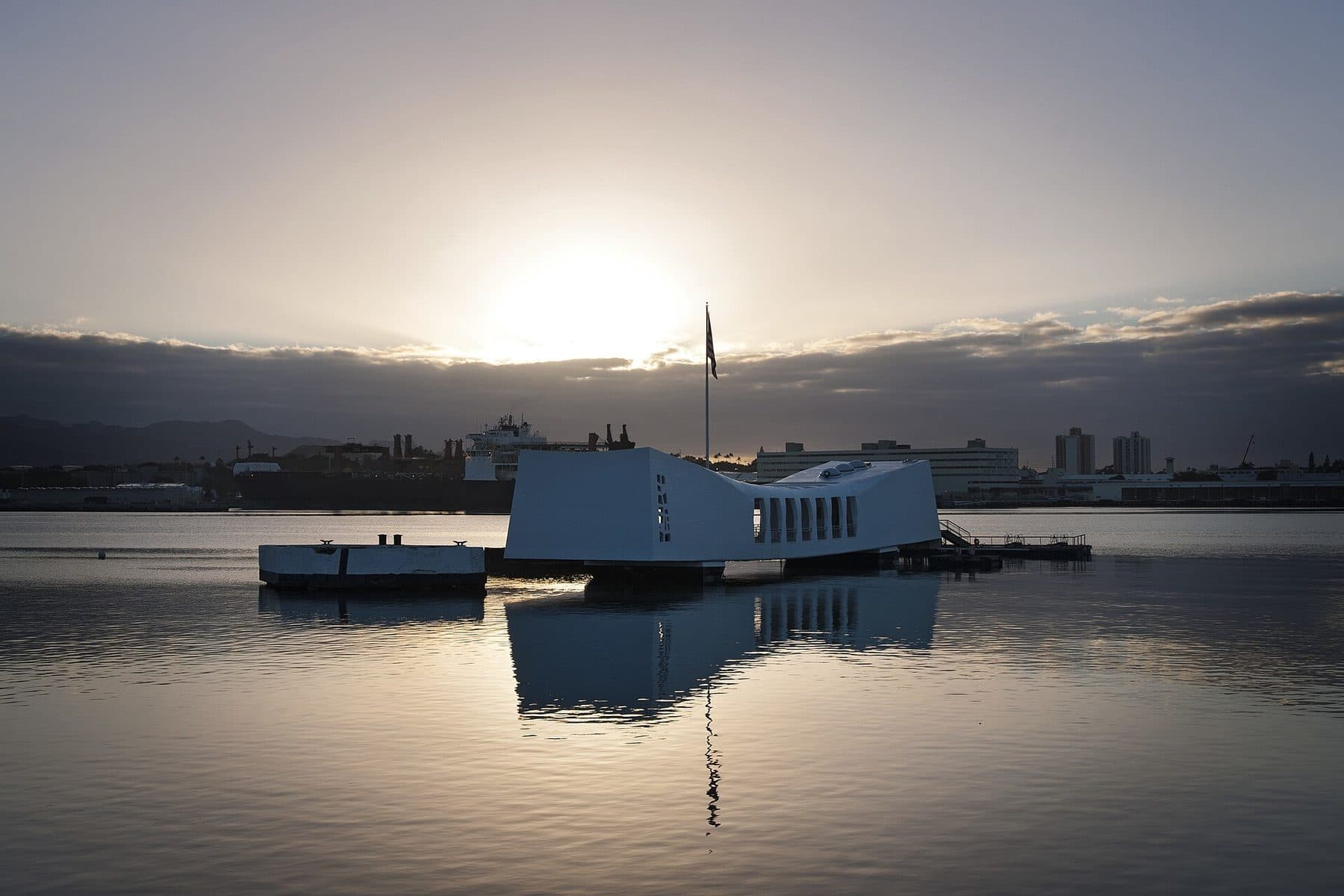 The USS Arizona Memorial at sunset in Pearl Harbor